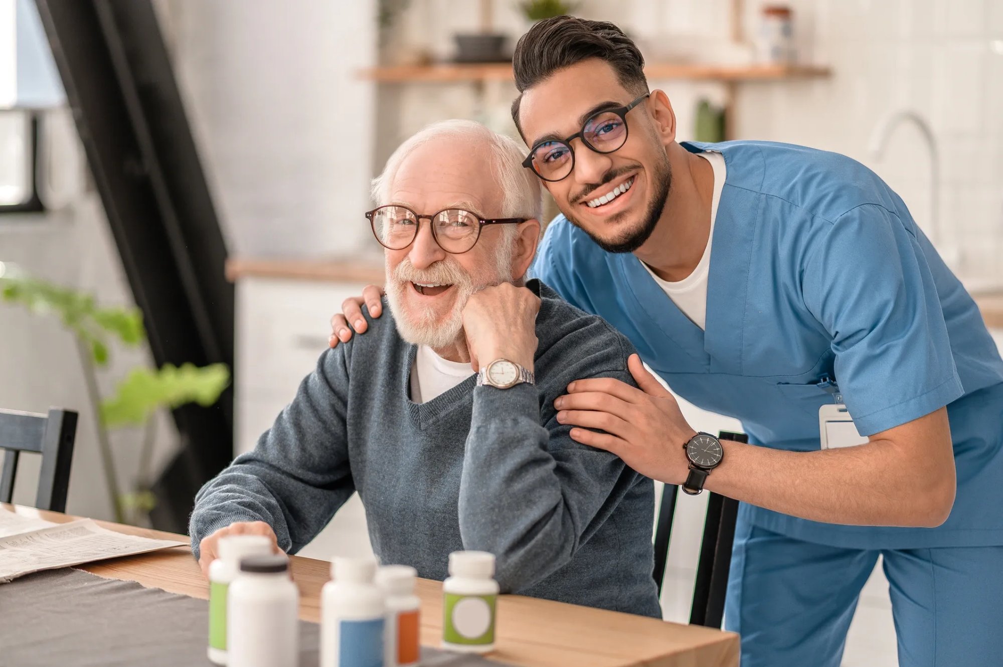 Nurse with elderly man at home